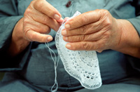 lady making lace cloth