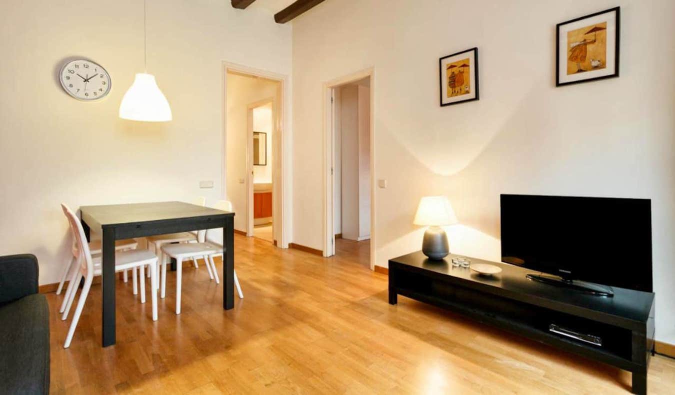 A simple, bright living room in an apartment-style hotel in Barcelona, Spain