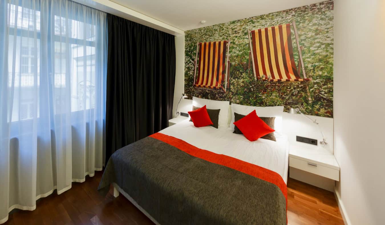A simple hotel room with art on the wall at the Bohem Art Hotel in Budapest, Hungary