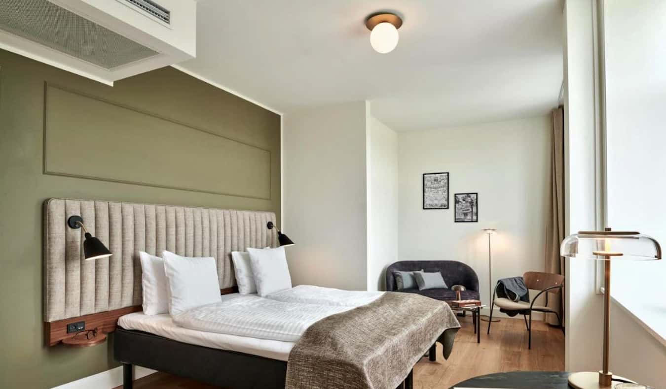 A roomy hotel room with lots of natural light at Hotel Sct. Thomas in Copenhagen, Denmark