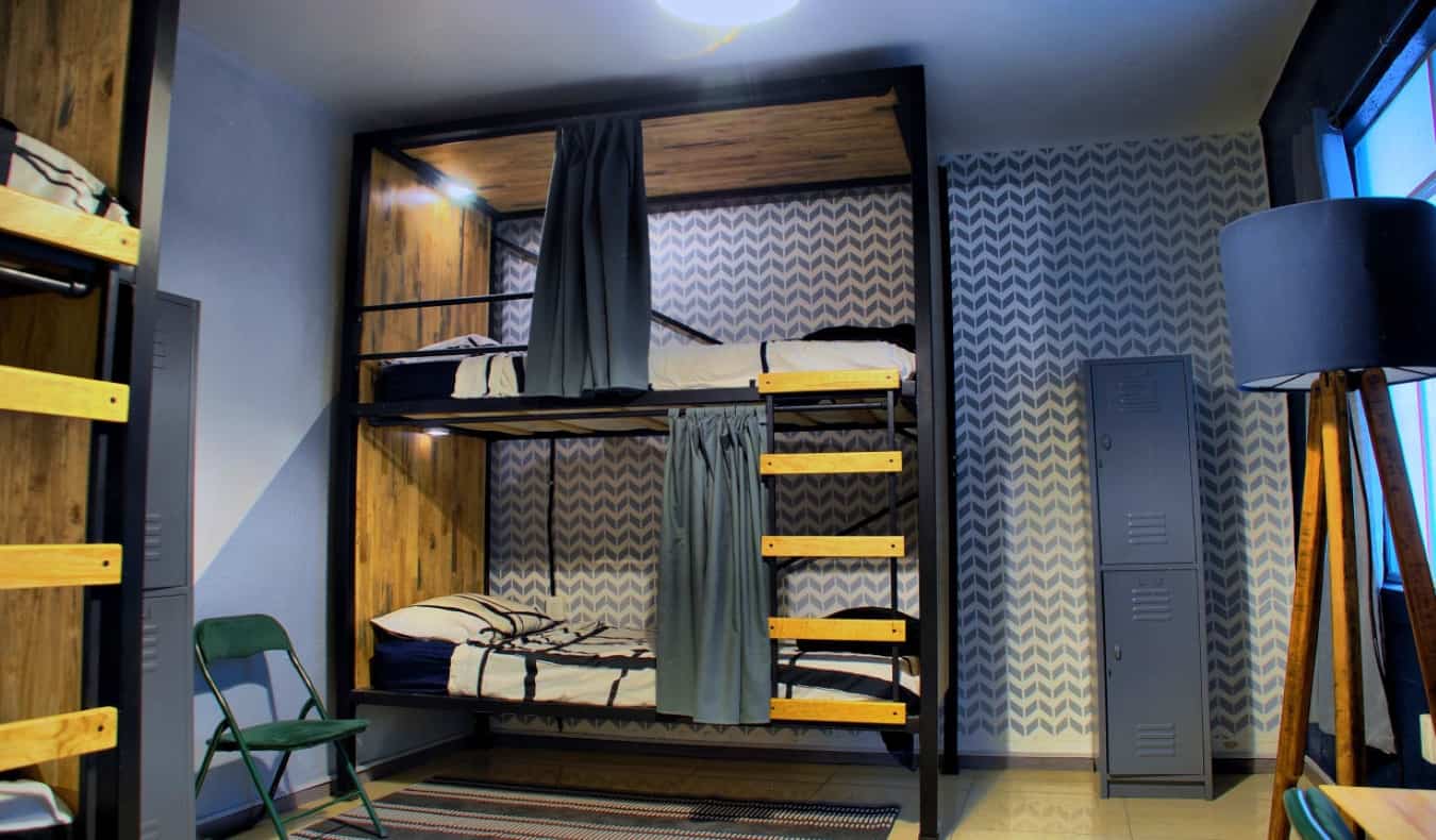 Modern wood bunk beds in dorm room at Wanderlust District in Mexico City